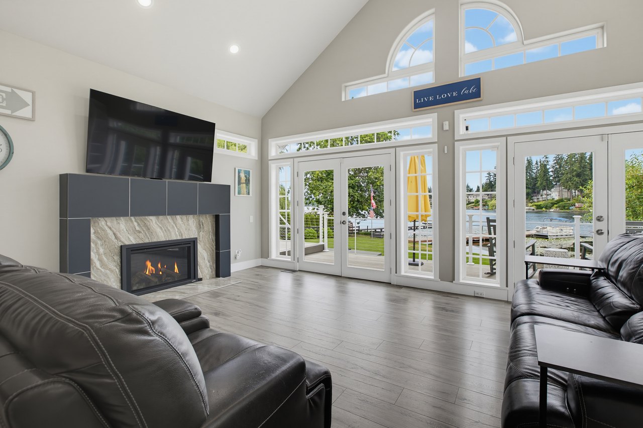 Vaulted great room with fireplace and lake-facing French doors, Lake Meridian waterfront home in Kent WA