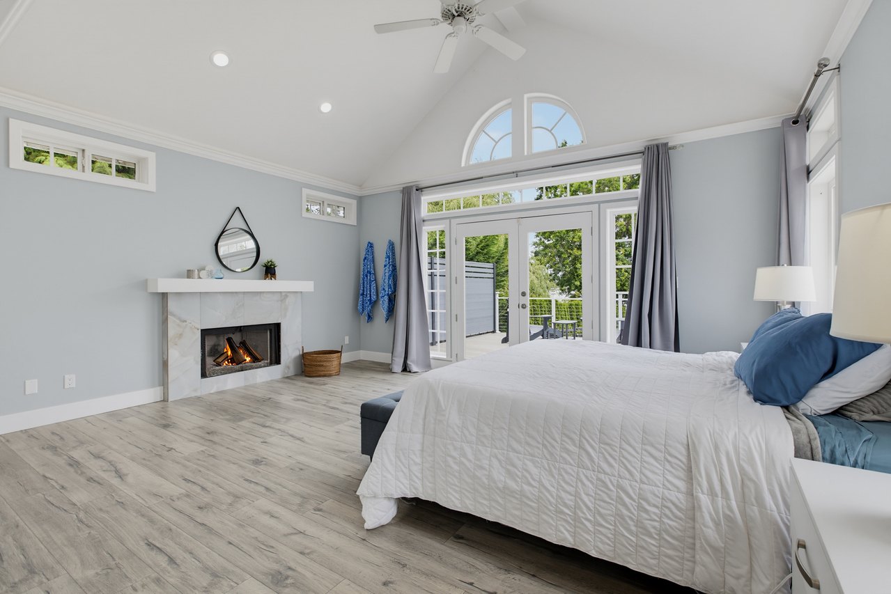 Primary suite with gas fireplace and lake views, Lake Meridian waterfront home for sale in Kent WA