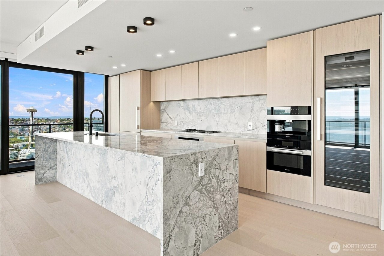 Marble waterfall island and white oak cabinetry, Residence 4504