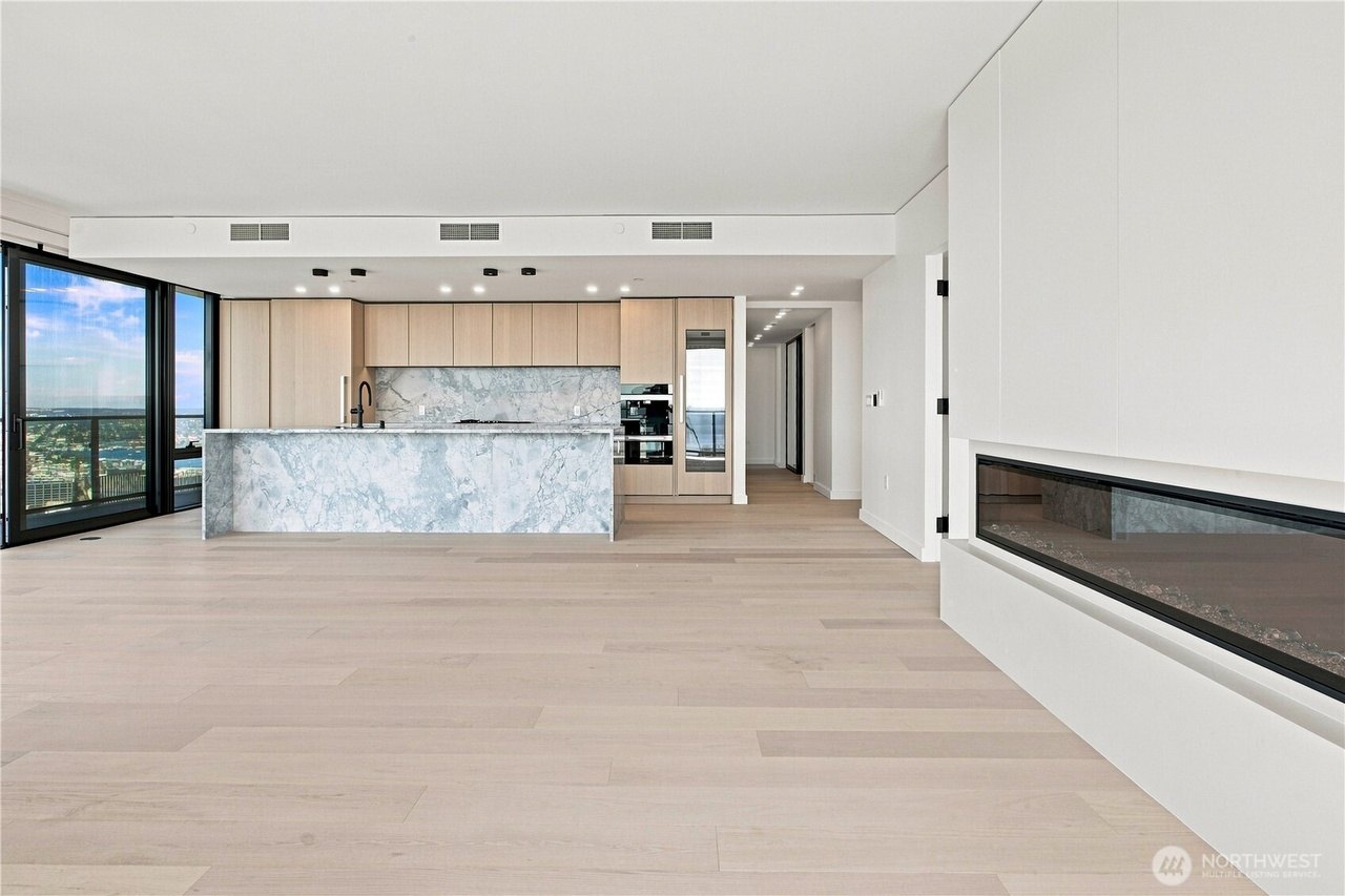 Empty living room and kitchen with electric fireplace, Residence 4504