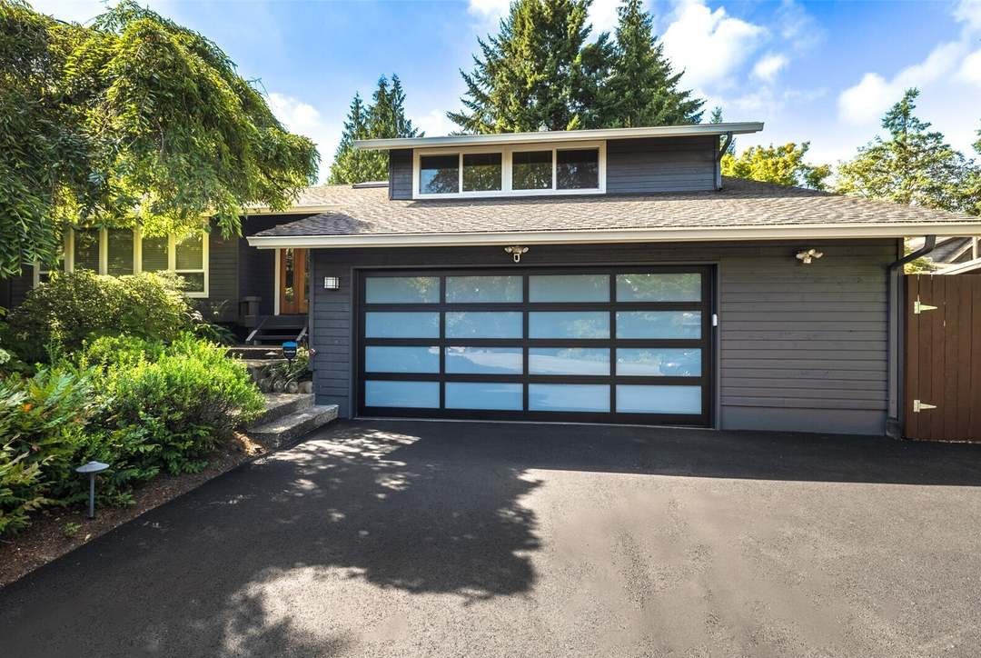 Front exterior with new paved driveway and garage door, 12617 NE 5th St, Bellevue